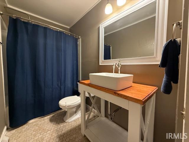 701 E Water St, Princeton, IN 47670 - bathroom featuring ornamental molding and vanity