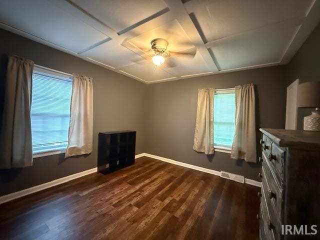 701 E Water St, Princeton, IN 47670 - unfurnished bedroom with coffered ceiling, dark wood-type flooring, and ceiling fan