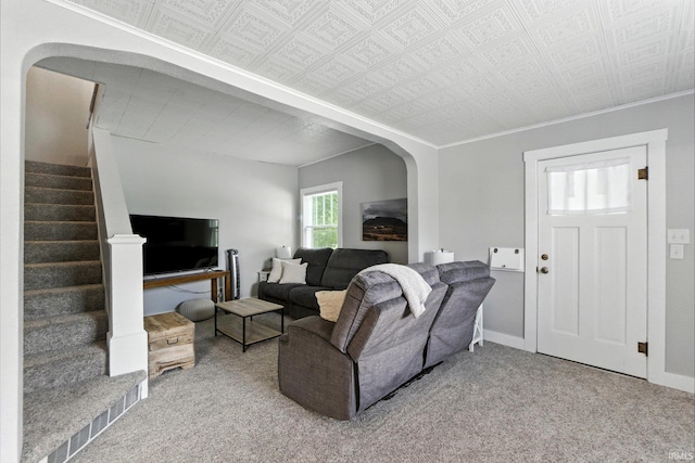 428 E Washington St, Bluffton, IN 46714 - carpeted living room with arched walkways, stairway, and an ornate ceiling