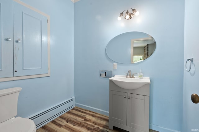 1208 Delta Blvd, Fort Wayne, IN 46805 - half bath with a baseboard radiator, vanity, and wood finished floors