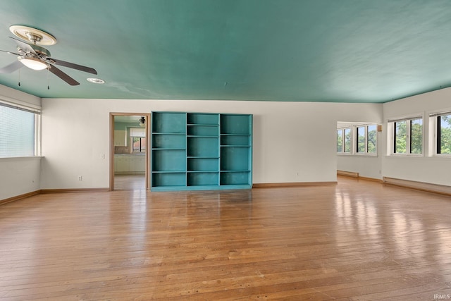 1208 Delta Blvd, Fort Wayne, IN 46805 - spare room with light wood-style floors, a baseboard heating unit, and a ceiling fan