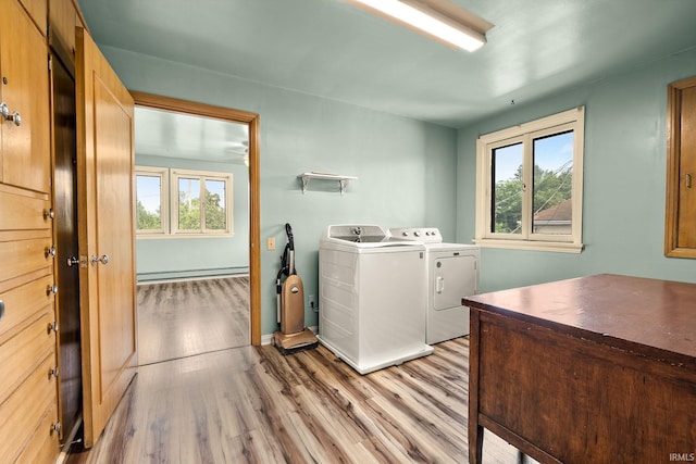 1208 Delta Blvd, Fort Wayne, IN 46805 - laundry room with baseboard heating, washing machine and clothes dryer, plenty of natural light, and light wood-type flooring