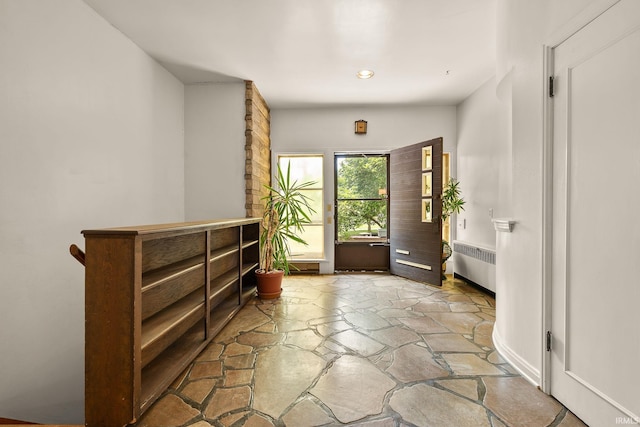 1208 Delta Blvd, Fort Wayne, IN 46805 - entrance foyer featuring radiator, stone floors, and recessed lighting