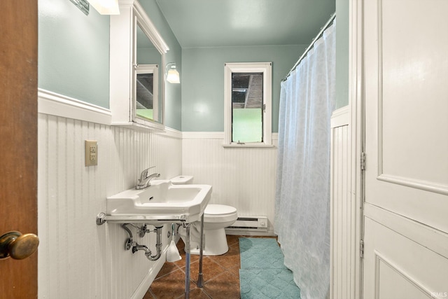 1208 Delta Blvd, Fort Wayne, IN 46805 - bathroom with a wainscoted wall, tile patterned floors, a baseboard radiator, and a shower with shower curtain