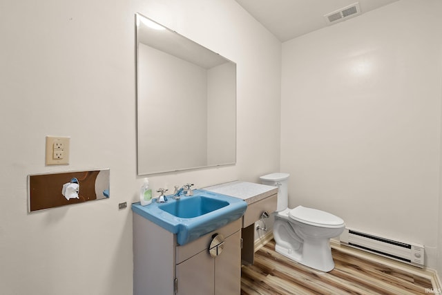1208 Delta Blvd, Fort Wayne, IN 46805 - bathroom with baseboard heating, wood finished floors, and vanity