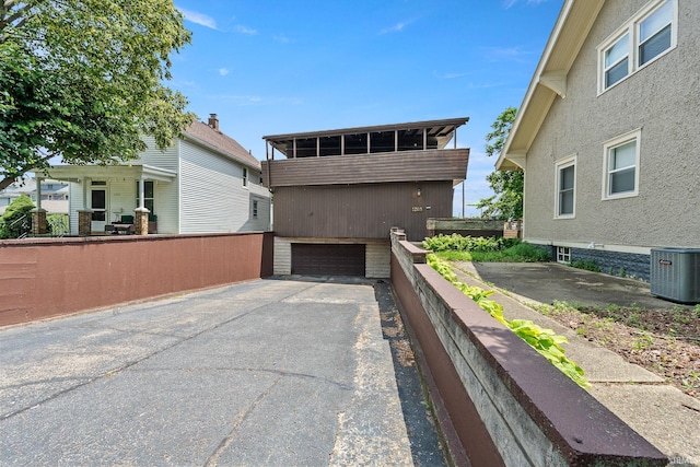 1208 Delta Blvd, Fort Wayne, IN 46805 - view of front facade with a garage and asphalt driveway
