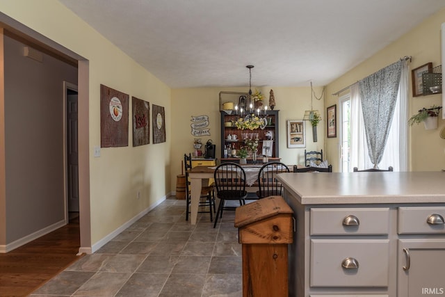 4600 N Shadow Wood Dr, Bloomington, IN 47404 - kitchen with a chandelier, light countertops, and pendant lighting