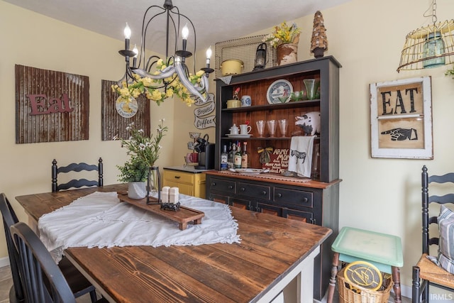 4600 N Shadow Wood Dr, Bloomington, IN 47404 - dining room with a chandelier and baseboards