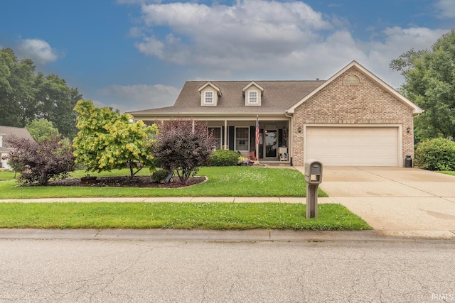 4600 N Shadow Wood Dr, Bloomington, IN 47404 - view of front of property with an attached garage, brick siding, a front yard, concrete driveway, and a shingled roof