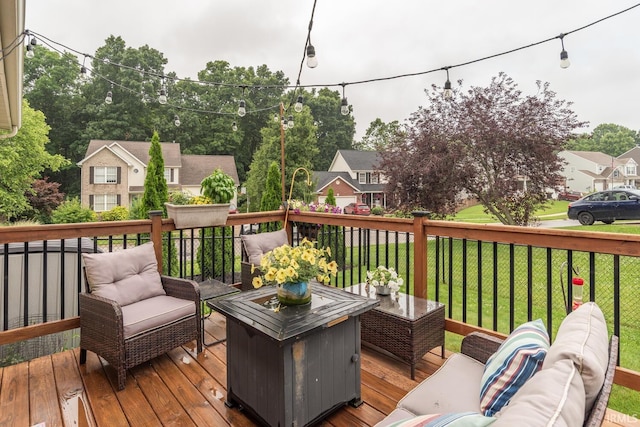 4600 N Shadow Wood Dr, Bloomington, IN 47404 - wooden deck featuring an outdoor living space, a lawn, and a residential view