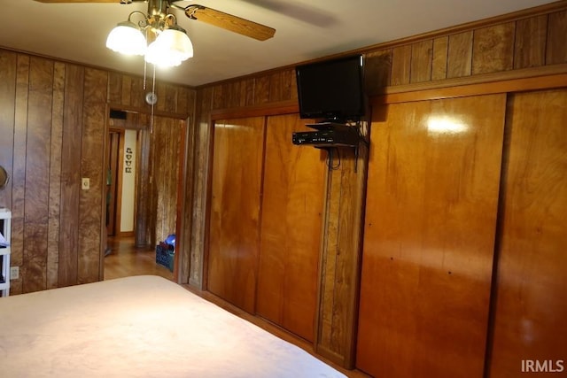 1120 E Fourth St, Mount Vernon, IN 47620 - unfurnished bedroom with wooden walls and ceiling fan