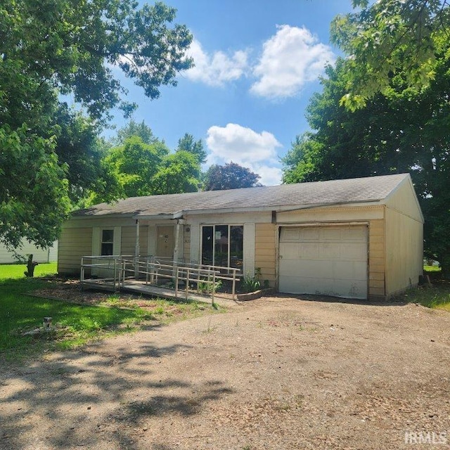 1823 Cambridge Dr, Warsaw, IN 46580 - ranch-style house with an attached garage and dirt driveway