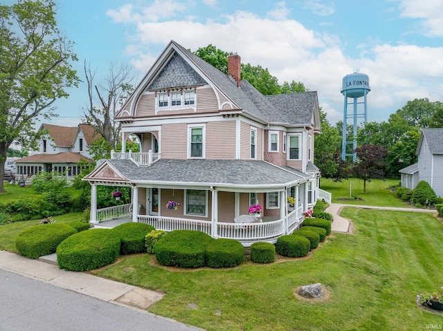 8 Hale St, Lafontaine, IN 46940 - victorian-style house featuring a porch, a shingled roof, a front yard, and a chimney