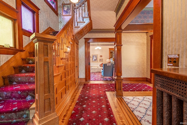 8 Hale St, Lafontaine, IN 46940 - staircase featuring wallpapered walls, decorative columns, and carpet