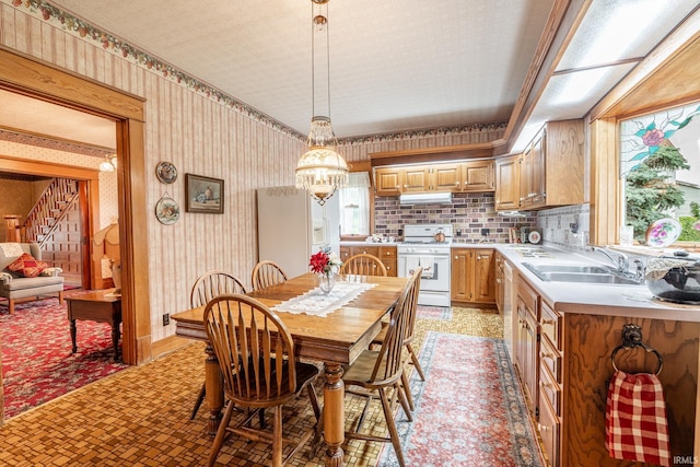 8 Hale St, Lafontaine, IN 46940 - dining room with a chandelier, wallpapered walls, stairs, and light flooring
