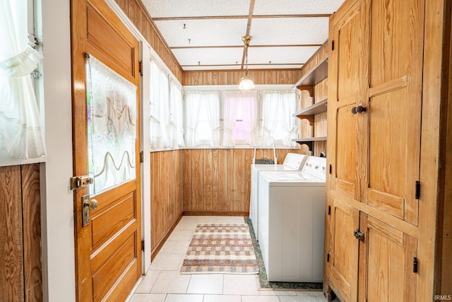 8 Hale St, Lafontaine, IN 46940 - laundry area featuring washer and dryer, light tile patterned flooring, and wood walls
