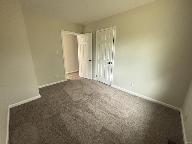 205 Corwin Ln, Fort Wayne, IN 46816 - unfurnished bedroom featuring carpet flooring and baseboards