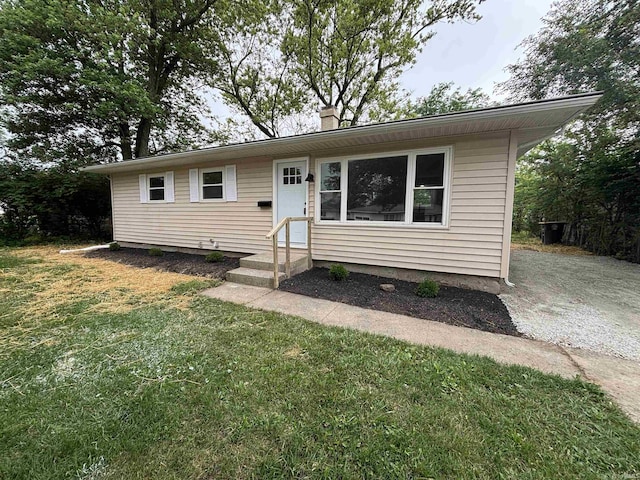 205 Corwin Ln, Fort Wayne, IN 46816 - view of front of property featuring a chimney and a front lawn