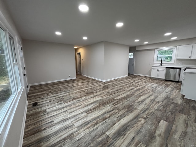 205 Corwin Ln, Fort Wayne, IN 46816 - kitchen featuring stainless steel dishwasher, dark wood-style flooring, open floor plan, recessed lighting, and white cabinetry