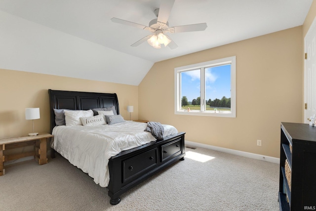 3631 E Pierceton Rd, Warsaw, IN 46580 - bedroom featuring light colored carpet, vaulted ceiling, and a ceiling fan