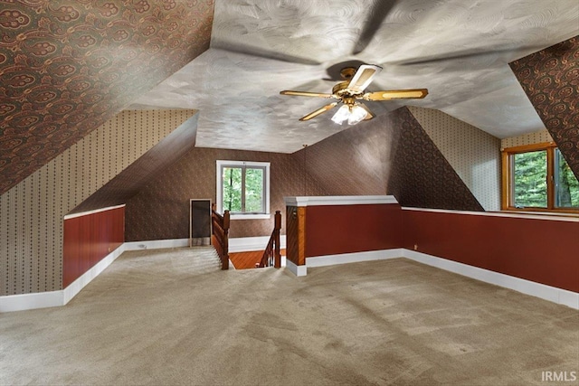 3911 Kings Ridge Rd, Mitchell, IN 47446 - additional living space featuring carpet floors, wallpapered walls, ceiling fan, and lofted ceiling