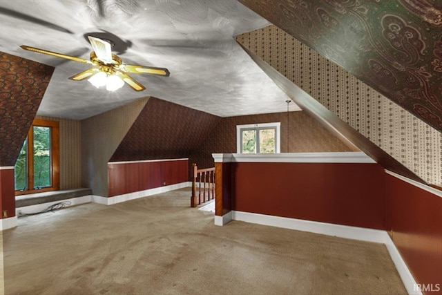 3911 Kings Ridge Rd, Mitchell, IN 47446 - additional living space with wallpapered walls, carpet, ceiling fan, and vaulted ceiling