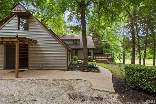 3911 Kings Ridge Rd, Mitchell, IN 47446 - rear view of property with a wooden deck and a patio