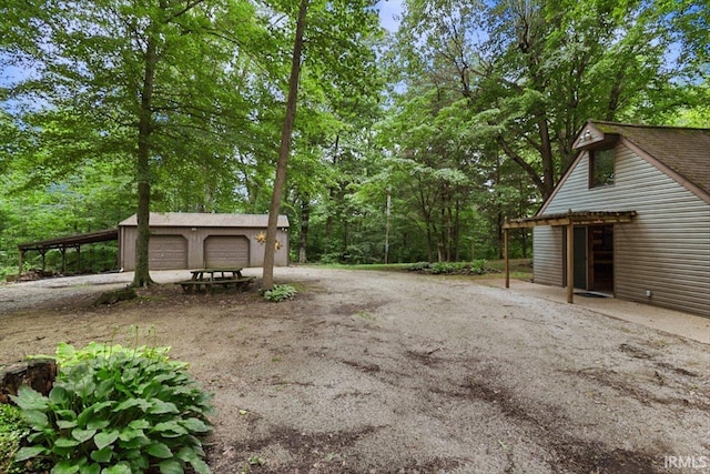 3911 Kings Ridge Rd, Mitchell, IN 47446 - view of yard featuring an outbuilding and a detached garage