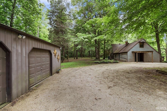 3911 Kings Ridge Rd, Mitchell, IN 47446 - garage featuring view of scattered trees