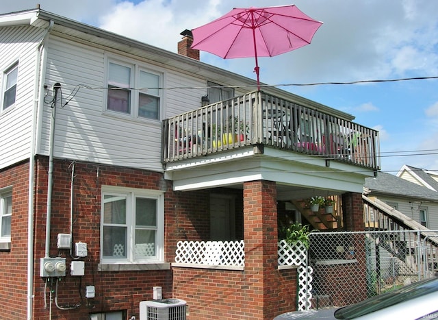 1907 E Chandler Ave, Evansville, IN 47714 - view of property exterior with brick siding and a balcony