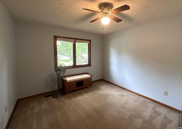 3108 E Charles Ct, Bloomington, IN 47401 - empty room with a ceiling fan, light carpet, and a textured ceiling