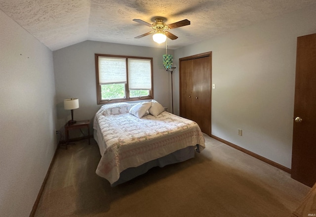 3108 E Charles Ct, Bloomington, IN 47401 - bedroom with a textured ceiling, light carpet, lofted ceiling, a ceiling fan, and a closet