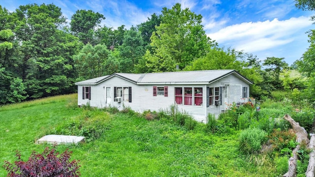 5462/5550 Patricksburg Rd, Spencer, IN 47460 - manufactured / mobile home with a metal roof and cooling unit