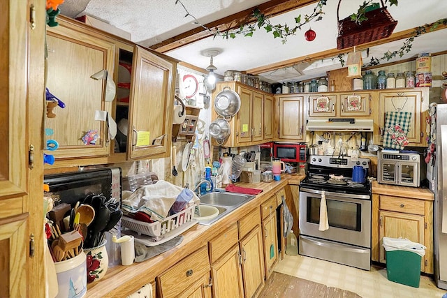 5462/5550 Patricksburg Rd, Spencer, IN 47460 - kitchen featuring stainless steel electric range, light countertops, under cabinet range hood, and light flooring