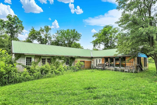 5462/5550 Patricksburg Rd, Spencer, IN 47460 - rear view of house featuring a metal roof and a yard