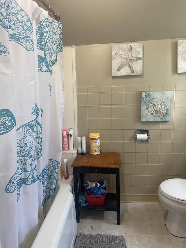 404 N Elizabeth St, Angola, IN 46703 - full bath with tile walls, shower / bath combination with curtain, and tile patterned flooring