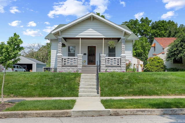 1028 Highland Ave, Lafayette, IN 47905 - view of front facade with stone siding, a porch, and stairs