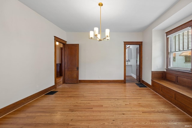 1028 Highland Ave, Lafayette, IN 47905 - unfurnished dining area featuring a chandelier and light wood-style flooring
