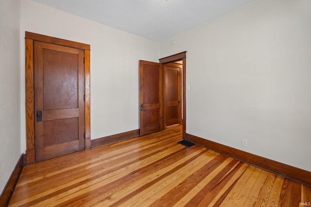 1028 Highland Ave, Lafayette, IN 47905 - unfurnished bedroom featuring baseboards and light wood-type flooring