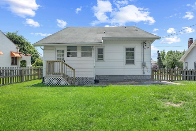 1028 Highland Ave, Lafayette, IN 47905 - rear view of house with a fenced backyard, a shingled roof, and entry steps