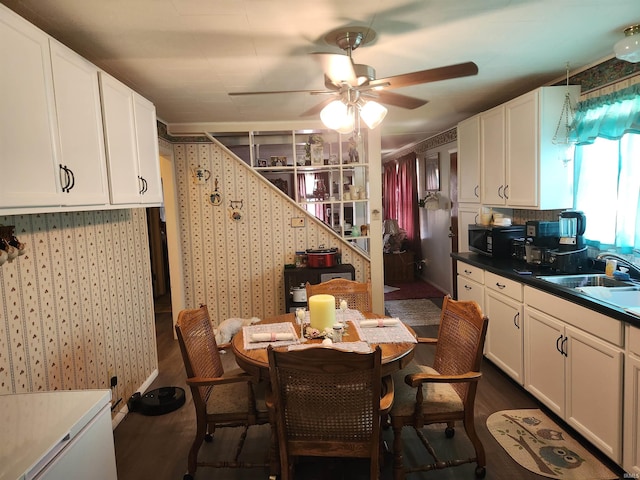 273 W Faculty St, Paoli, IN 47454 - dining space with dark wood-style flooring and ceiling fan