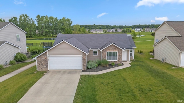7070 Desdemona Xing, Fort Wayne, IN 46818 - view of front of home featuring stone siding, driveway, an attached garage, a water view, and a front lawn