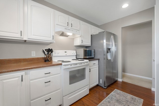 7070 Desdemona Xing, Fort Wayne, IN 46818 - kitchen with stainless steel appliances, under cabinet range hood, white cabinetry, dark wood-style floors, and recessed lighting