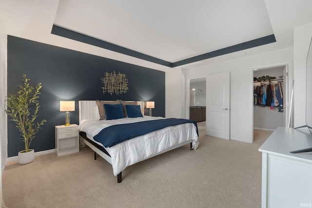 7070 Desdemona Xing, Fort Wayne, IN 46818 - bedroom featuring a raised ceiling, light colored carpet, a spacious closet, and a closet