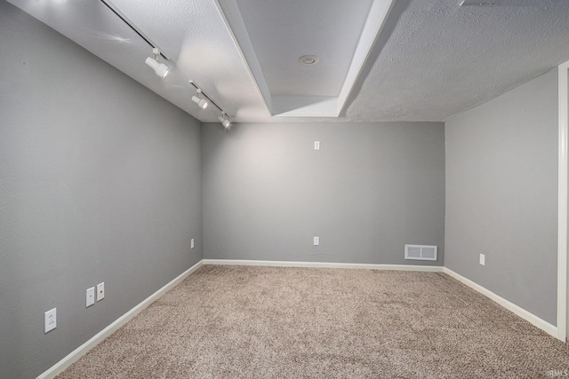 14341 Teal Ct, Granger, IN 46530 - unfurnished room featuring carpet, track lighting, and a textured ceiling