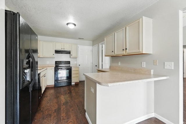 2005 Priscilla Ln, Kendallville, IN 46755 - kitchen with black appliances, under cabinet range hood, a peninsula, light countertops, and dark wood-style floors