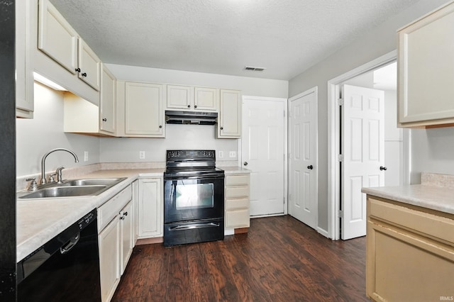 2005 Priscilla Ln, Kendallville, IN 46755 - kitchen featuring black appliances, under cabinet range hood, dark wood-style flooring, light countertops, and white cabinetry