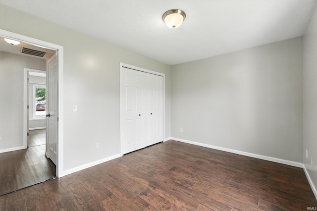 2005 Priscilla Ln, Kendallville, IN 46755 - unfurnished bedroom with dark wood-type flooring and a closet