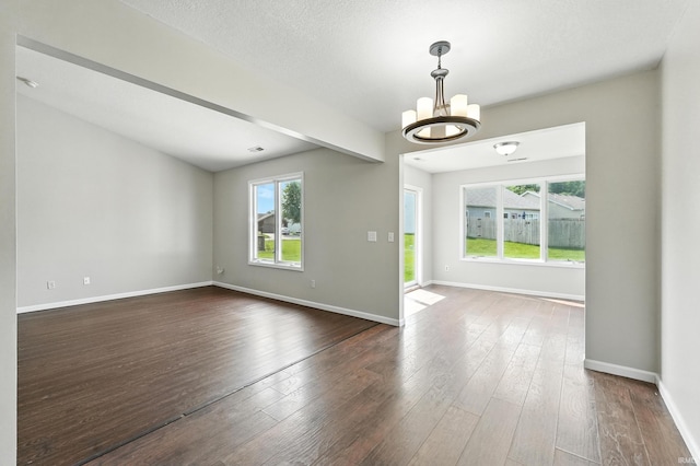 2005 Priscilla Ln, Kendallville, IN 46755 - empty room featuring a chandelier and dark wood-style floors