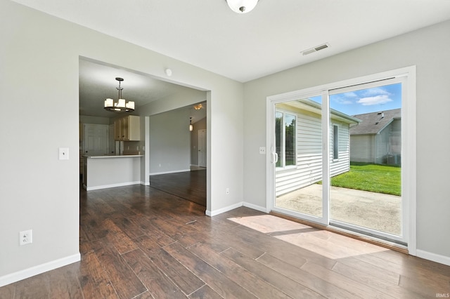 2005 Priscilla Ln, Kendallville, IN 46755 - empty room featuring dark wood finished floors and a chandelier